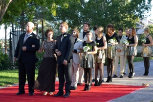 Led by Jared Joerger and his parents, the groomsmen accompanied the bridesmaids down the aisle.